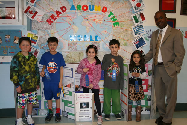 Nathaniel Coulter beside an early STEM science fair display